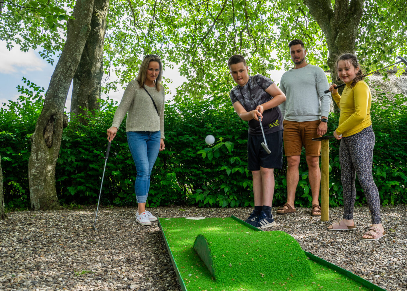 Compete with your family in a game of miniature golf